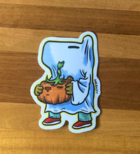 Load image into Gallery viewer, Sticker of Capy (??) holding a pumpkin on a wooden surface